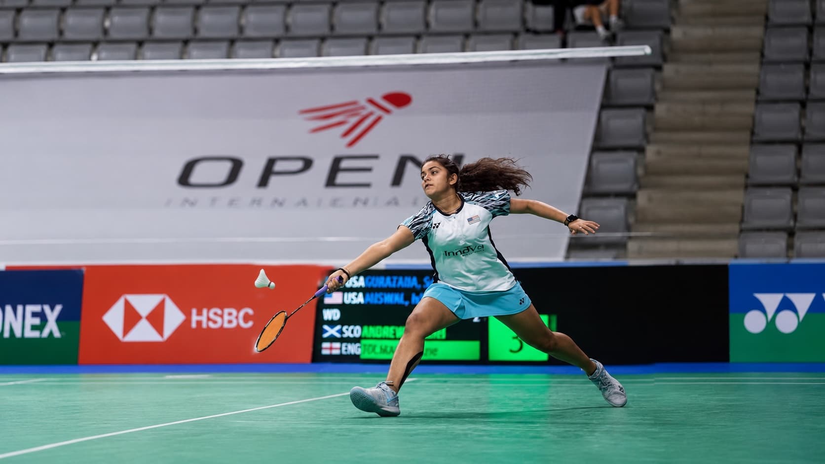 Srivedya Gurazada lunging for a shot in a women's doubles match for the United States